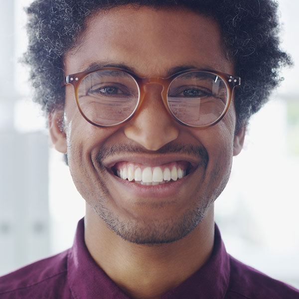 smiling man wearing glasses